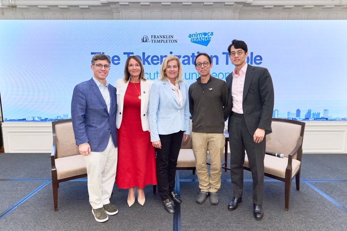 A panel of speakers pose for a photo at an event hosted by Franklin Templeton and Animoca Brands, with the backdrop displaying "The Tokenization Table." The image captures the presenters who participated in the discussion about the collaboration to bring tokenized real-world assets to NUVA Finance, as referenced in the accompanying text.