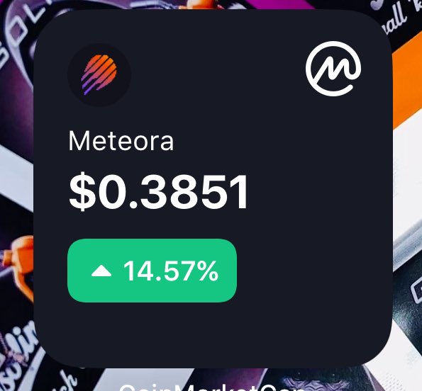 A cryptocurrency price display showing 'Meteora' token at $0.3851 with a ▲ 14.57% gain, featuring a colorful logo and the CryptoMarkets watermark.