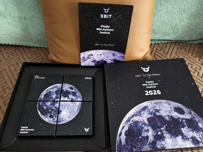 'XBIT' branded Mid-Autumn Festival 2026 gift boxes featuring moon imagery and 'XBIT: To The Moon' text are displayed.