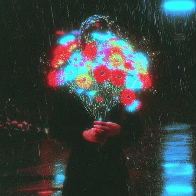 A person in a dark hoodie holds a bouquet of brightly colored flowers in the rain at night, with a red glow on their hands and a blue light in the background.