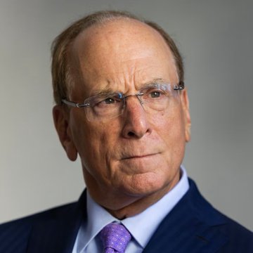 An older man with glasses, wearing a dark blue suit and purple tie, looks seriously toward the camera in a formal portrait. The image likely depicts a BlackRock executive, tying into the news of BlackRock clients selling $444.51 million worth of Bitcoin ($BTC).