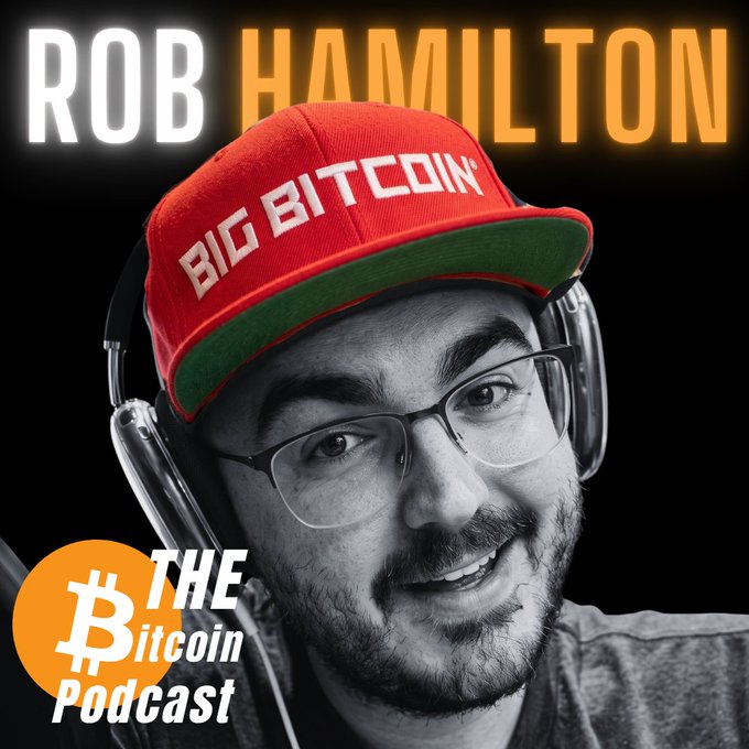 Rob Hamilton, wearing a red "Big Bitcoin" cap and headphones, is featured as the host of "The Bitcoin Podcast" with his name displayed prominently above his headshot. The graphic promotes an episode titled "Bitcoin Red Team: The AI Arms Race for Open-Source Security," with the show's logo in the bottom left corner.