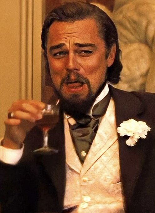 A well-dressed man with long hair, a beard, and a white boutonniere holds a wine glass while displaying a contemptuous, disdainful facial expression. The image humorously illustrates the accompanying post's elitist web3 braggadocio, with the man's smug, judging look embodying the condescending attitude of someone dismissing those who don't meet their arbitrary wealth threshold.