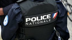 The image displays a "POLICE NATIONALE" vest, representing French national police, which connects to the post's discussion of a violent cryptocurrency-linked kidnapping in Vendin-le-Vieil where police would be involved in investigating the attack.