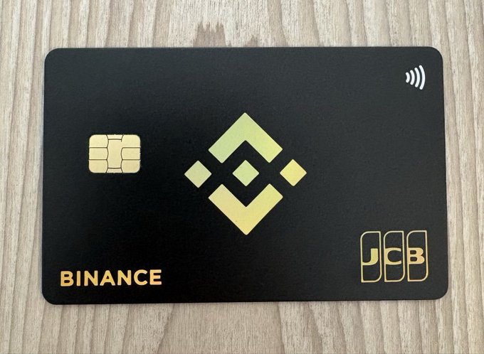 The image features a black credit card with a gold logo of a Bitcoin symbol on it. The card has a Visa logo at the bottom right corner, indicating that it's a Visa credit card. The text "South Asia might be next for Binance Virtual Card!" suggests that the card could potentially be used in South Asia or other regions where Binance is expanding its reach. This implies that users of this card can enjoy seamless payments and access to Bitcoin services across different countries, promoting real-world adoption of cryptocurrency technology.