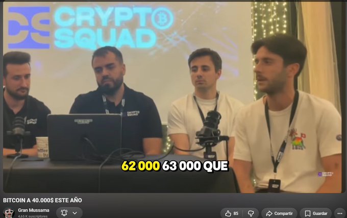 The image shows four men at a "Crypto Squad" event with a subtitle reading "62 000 63 000 QUE," while the YouTube video below titled "BITCOIN A 40.000$ ESTE AÑO" by "Gran Mussama" (4.65K subscribers) displays the prediction about Bitcoin bottoming between $62,000 and $63,000. The post highlights the irony of the crypto influencer's failed Bitcoin price prediction, noting that by May 9, Bitcoin had already dropped below his projected bottom range.