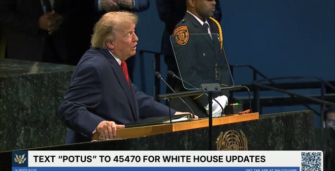 Donald Trump speaks at a podium with text 'TEXT "POTUS" TO 45470 FOR WHITE HOUSE UPDATES' at the bottom of the screen.