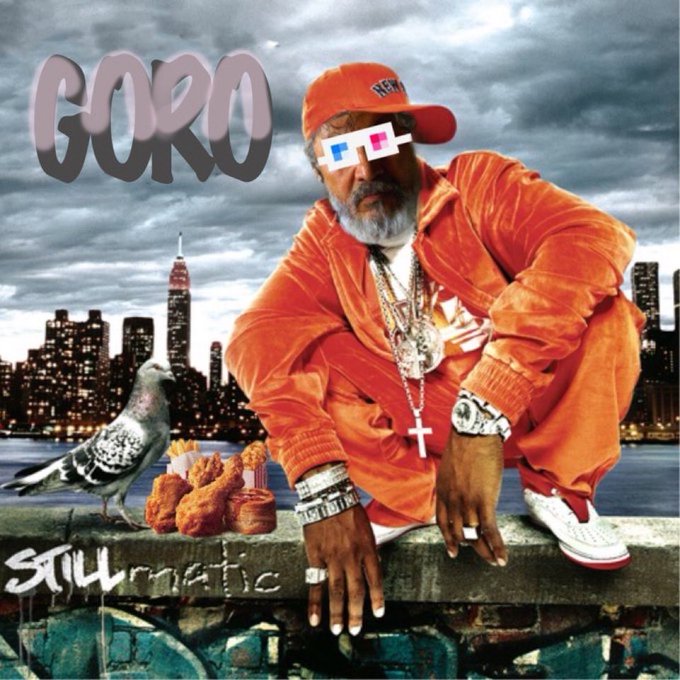 An album cover or promotional image featuring a man in an orange outfit and 3D glasses, with the text 'GORO' and 'STILLmatic', a pigeon, fried chicken, and a New York City skyline in the background.