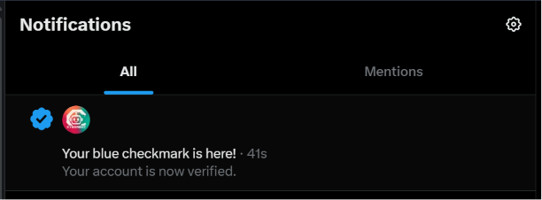 A Twitter/X notifications screen showing a verification message: 'Your blue checkmark is here! Your account is now verified.'