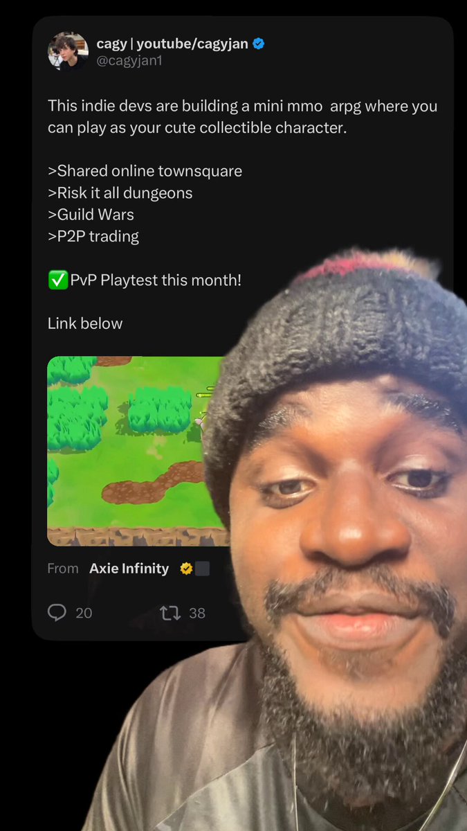 "Holla @Jihoz_Axie", a man with an African American face wearing a gray jacket, is smiling at the camera while showing off his video game skills. The picture shows him playing video games using a mobile device as part of his gaming experience. The image also includes some text that reads: 
"This indie devs are building a minico... online town square with shared online town squares."