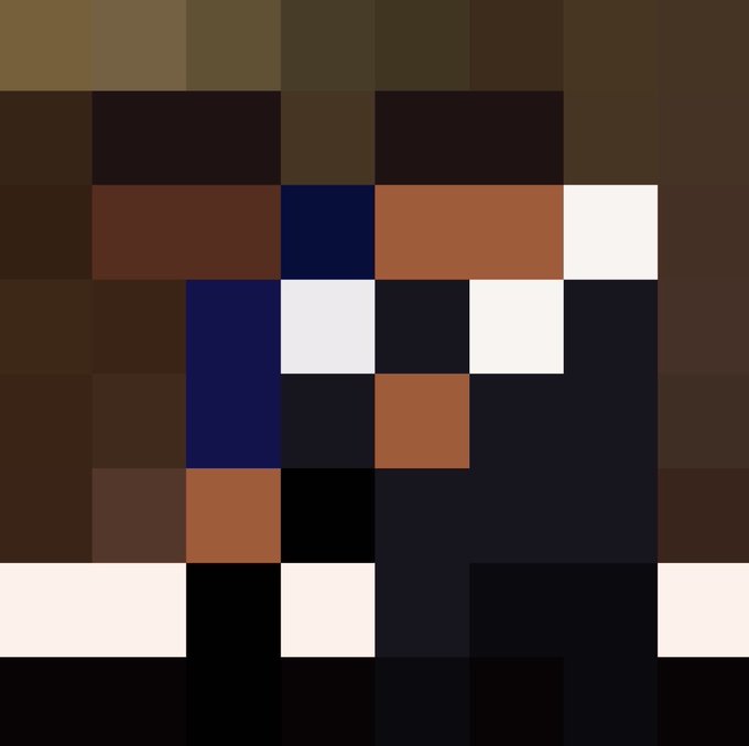 Low-resolution pixel art image made up of brown, white, and dark blue squares forming a crude portrait or character design.