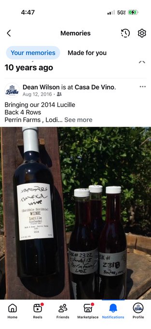 Facebook Memories screenshot showing a post from 10 years ago by Bella wine shop, featuring a 2014 Lucille Back 4 Rows bottle of wine from Perrin Farms alongside smaller bottles of red liquid.