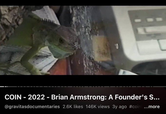 The image shows a screenshot from a YouTube video titled "COIN - 2022 - Brian Armstrong: A Founder's S..." posted by @gravitasdocumentaries, featuring an iguana in front of a printer (2.6K likes, 146K views, 3y ago).

The image relates to the post as it appears to be from a documentary about Coinbase CEO Brian Armstrong, whose pet iguana is referenced in the caption as the inspiration behind the $SPIKE meme coin on the Base network.