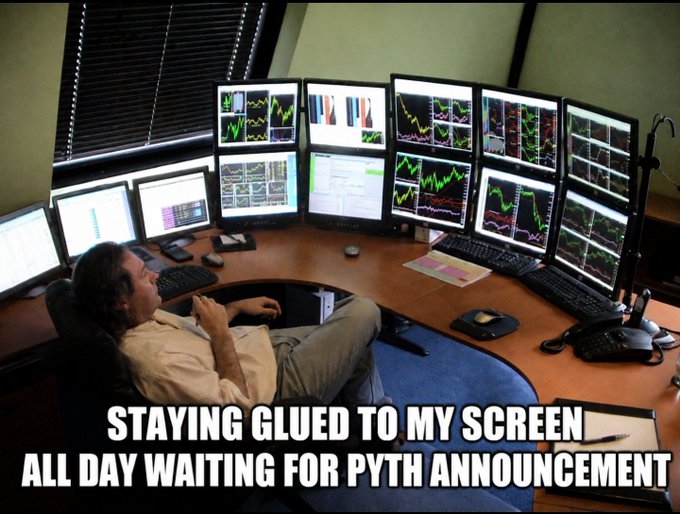 A meme showing a man relaxing at a desk surrounded by multiple monitors displaying stock charts, captioned 'STAYING GLUED TO MY SCREEN ALL DAY WAITING FOR PYTH ANNOUNCEMENT'.