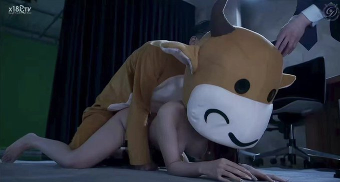 This image shows a person in a bull costume with the text "X18TV" visible in the upper left corner, relating to the post about a "bull" market. The user mentions holding stocks like SNDK, AXTI, SKHY, MRVL, CBRS, and GLW, suggesting a connection to market trends.