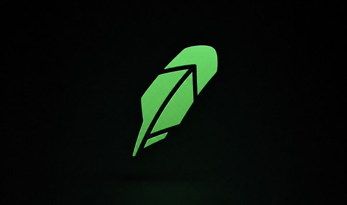 A glowing green feather/leaf-shaped logo displayed against a dark background.