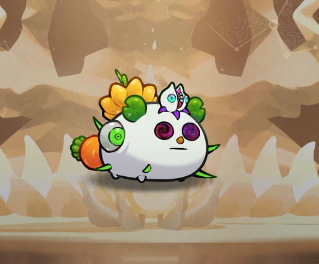 A small, white Axie creature with green spikes, a sunflower on its head, and colorful swirled eyes stands on a stone platform within a cave-like setting. The image showcases the fully-evolved Axie NFT, as referenced in the caption celebrating reaching its 5th evolution.