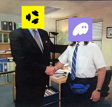 Two office workers shake hands in an office setting, with their faces humorously covered by a yellow cat poop emoji and a purple ghost emoji.