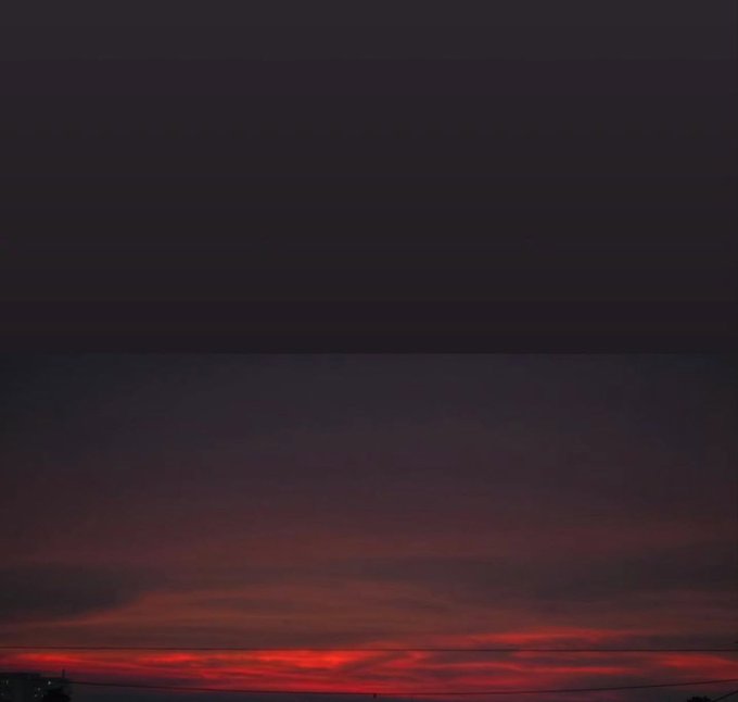 A vivid red sunset fading into a deep dark sky with silhouetted power lines, capturing the peaceful end of day as the post bids "Good Night" to its crypto community while reflecting on Bitcoin and Ethereum's shared mission.