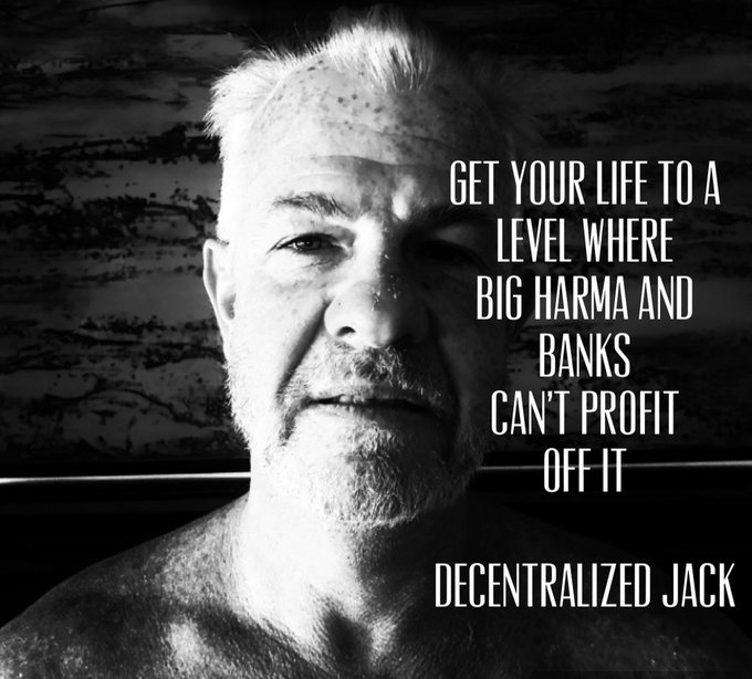 A black-and-white portrait of an older, shirtless man with a stoic expression appears alongside a quote attributed to "Decentralized Jack" that reads, "GET YOUR LIFE TO A LEVEL WHERE BIG PHARMA AND BANKS CAN'T PROFIT OFF IT." The image aligns with the post's theme of advocating decentralization and resisting centralized control by powerful industries.