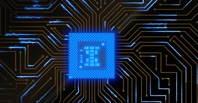 A close-up of a glowing blue computer chip or processor on a circuit board, symbolizing technology and computing power.