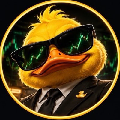The image shows a stylized anthropomorphic duck character wearing a black suit with a tie and a small duck pin, along with dark sunglasses that reflect green candlestick charts, all framed within a glowing orange circle. This visual perfectly complements the post's hype around "QUACK AI" by portraying the mascot as a sophisticated, bullish trader ready to launch on Robinhood, with the chart reflections in the shades symbolizing the impending "explosion" of the coin and its journey to the moon.