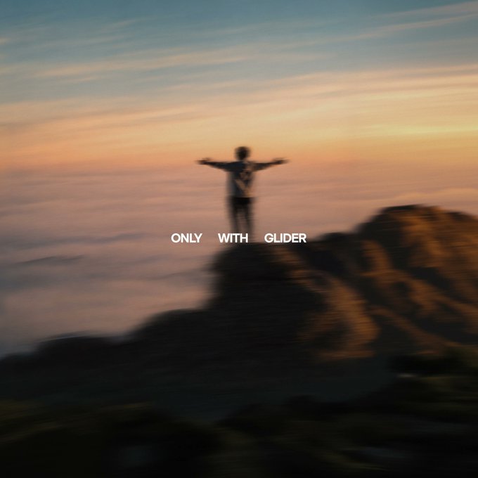 A silhouette of a person standing triumphantly on a rocky outcrop with arms outstretched against a sunset sky, accompanied by the text "ONLY WITH GLIDER," evokes the freedom and elevation that the Glider investing app aims to provide through its hands-off, optimized portfolio management.