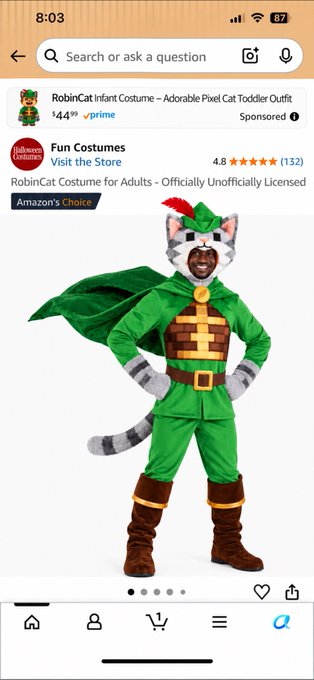 An Amazon mobile screenshot showing a sponsored listing for 'RobinCat Infant Costume - Adorable Pixel Cat Toddler Outfit' priced at $44.49, with an image of a man wearing a green cat-themed Robin Hood costume.