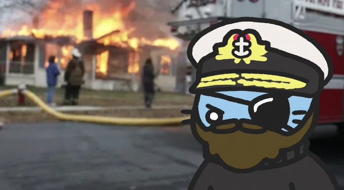 A cartoon cat character dressed as a ship captain with an eye patch and beard, superimposed in front of a news photo of a house fire with firefighters and a fire truck.