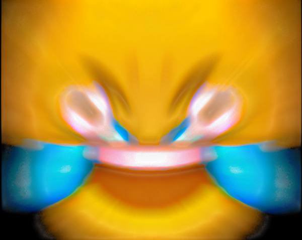 A heavily blurred image showing abstract yellow, blue, and pink colors with what appears to be a face or character.