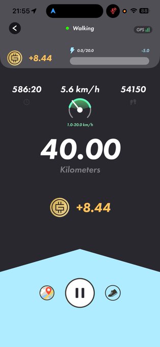 A STEPN fitness app screenshot showing a walking activity in progress, displaying 40.00 kilometers total, 586:20 time, 5.6 km/h current pace, and +8.44 energy earned. The post humorously notes having 2km left while complaining about carrying an umbrella, which matches the app's current "Walking" status and remaining distance to complete the 40km goal.