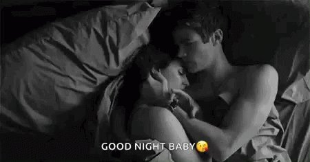 The image shows a couple lying down together, with one person wearing a white shirt and the other person wearing a black shirt. The text "Good night baby" is written below them, suggesting that they are spending quality time together at night.