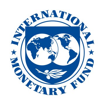 The image displays the official seal of the **International Monetary Fund (IMF)**, featuring a blue circular emblem with a globe showing the Eastern and Western Hemispheres encircled by the text "INTERNATIONAL MONETARY FUND." The seal is directly relevant to the post, as it represents the IMF—the institution that published the new paper warning about dollar stablecoins potentially worsening currency crises.