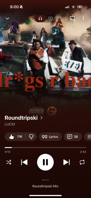 A Spotify playback screen shows the song "Roundtripski" by LUCKI playing from the album, with 11K likes and a parental advisory label visible.