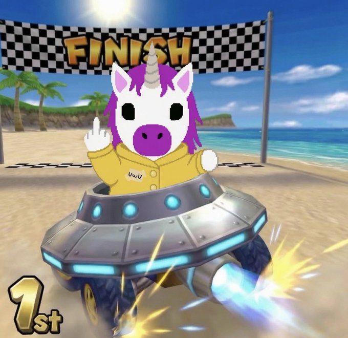 A cartoon unicorn character in a yellow jacket giving the middle finger while riding in a futuristic UFO kart, crossing a checkered finish line marked 'FINISH' on a tropical beach, with '1st' displayed in the corner.
