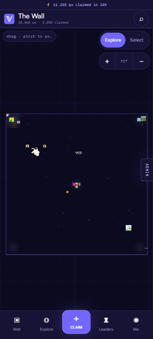 A mobile app interface for a virtual game called 'The Wall' shows a dark space-themed map where 11,265 PX has been claimed in 24 hours, featuring navigation tabs for Wall, Explore, Claim, Leaders, and Me.