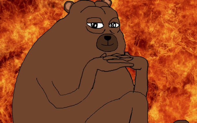 A cartoon illustration of a brown bear with a sly expression, resting its chin on its hands against a background of intense orange flames.