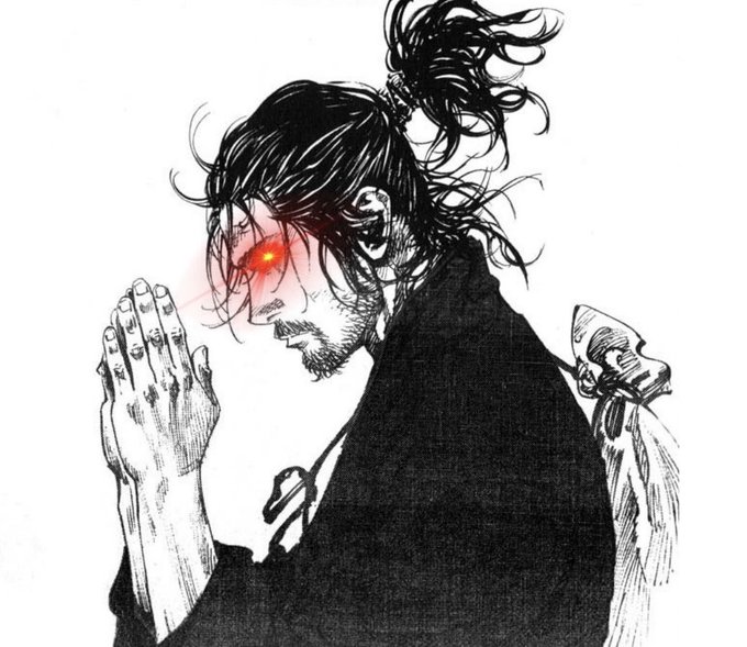 A black and white manga-style illustration depicts a bearded man with long hair tied in a high ponytail, one glowing red eye, and hands clasped together in a prayer gesture.