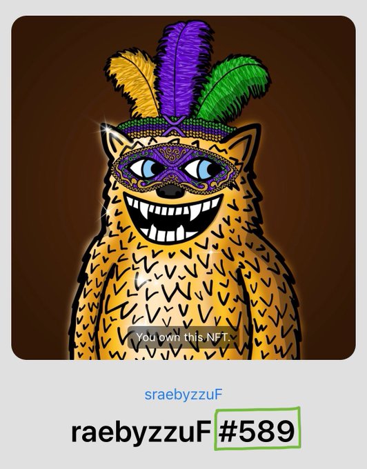 An NFT image showing a yellow creature wearing a colorful feathered mask and hat, labeled 'raebyzzyuF #589'.