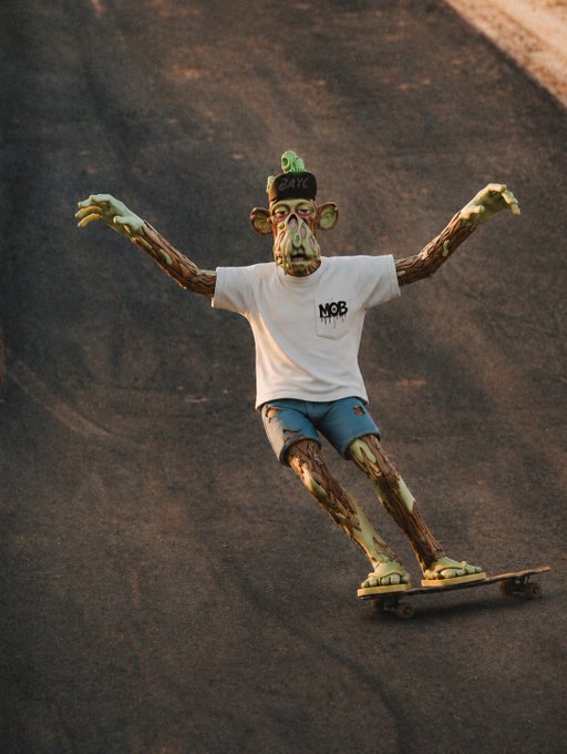 A 3D rendering of a scrawny, monster-like figure wearing a white "MOB" t-shirt, blue shorts, sandals, and a green hat, balancing on a skateboard on dark asphalt.