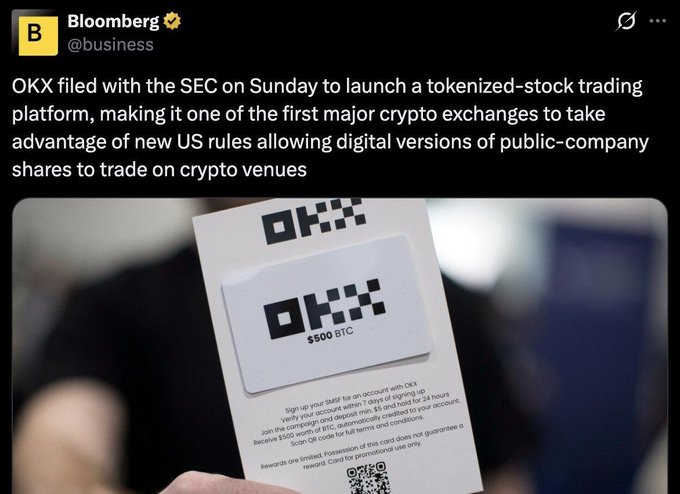 A Bloomberg tweet from @business announcing that OKX filed with the SEC to launch a tokenized-stock trading platform, accompanied by an image of someone holding an OKX $500 BTC card.