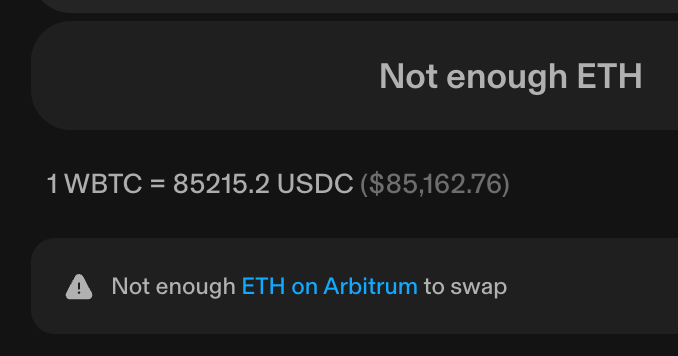A cryptocurrency exchange error screen displaying 'Not enough ETH', showing a rate of '1 WBTC = 85215.2 USDC ($85,162.76)' and a message 'Not enough ETH on Arbitrum to swap'.