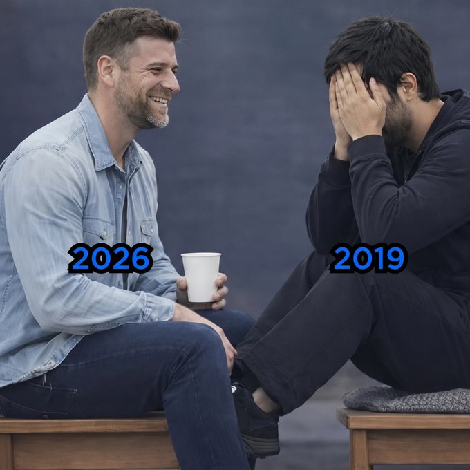 A meme showing two men sitting on benches having a conversation; the smiling man on the left is labeled '2026' and the man with his face in his hands on the right is labeled '2019'.
