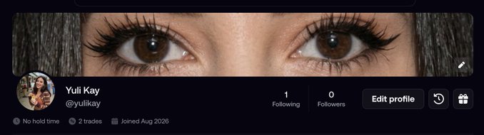 A Twitter/X profile banner for 'Yuli Kay' (@yulikay) showing an extreme close-up of her eyes as the header image, with profile stats indicating 1 Following and 0 Followers, 'No hold time', 2 trades, and joined August 2026.