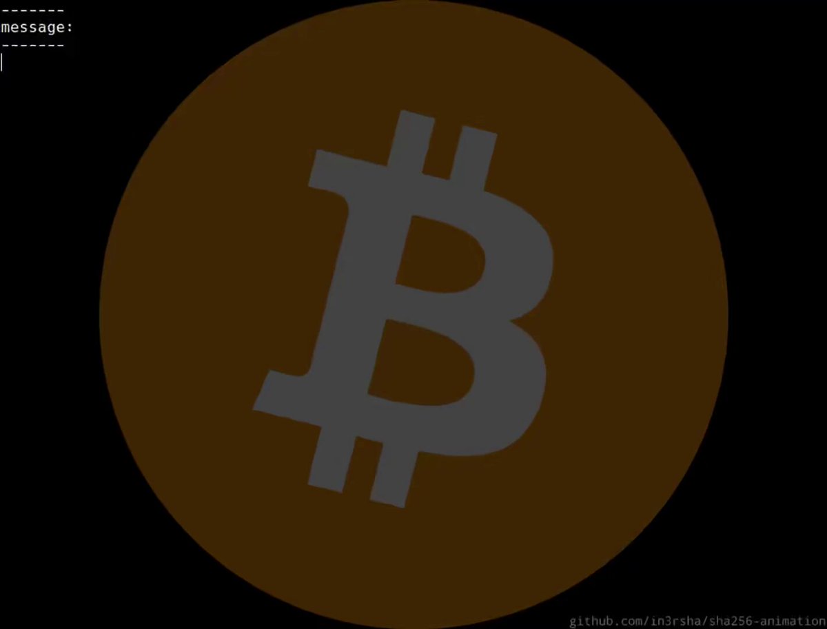 The image features a large, circular logo with a gray "B" at its center. The background of the image is black, which contrasts with the brown outline of the logo. Below the logo, there's text that reads "The First Bitcoin Block Mined 17 Years Ago". This suggests that the image might be related to a discussion or presentation about the history and origins of Bitcoin.