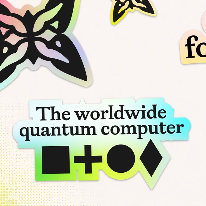 A colorful graphic sticker features a butterfly, geometric shapes, and the text 'The worldwide quantum computer'.