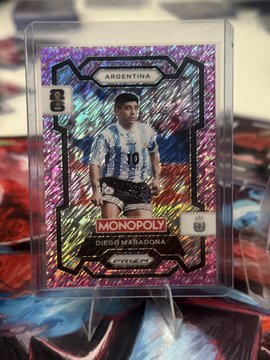 A Panini Prizm Monopoly trading card of Argentina's Diego Maradona (#10), displayed in a protective case.