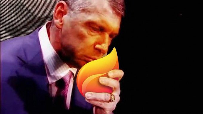 A man in a suit appears to be smelling a flame-shaped object while holding it close to his face, visually illustrating the post's warning about not getting "sidelined" on the fire emoji trend.