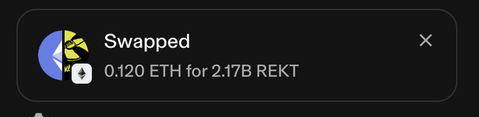 A dark UI notification card showing a crypto token swap transaction reading 'Swapped 0.120 ETH for 2.17B REKT' with a yellow and blue circular icon.