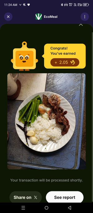 A screenshot of the EcoMeal app showing a "Congrats! You've earned +2.05" reward notification alongside a photo of a meal containing rice, greens, meat, and an egg on a paper plate.